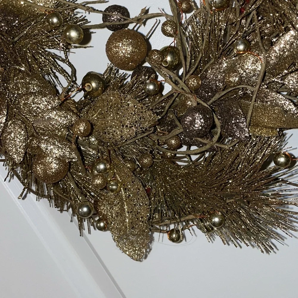Golden decorative handing wreath